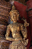 Chiang Mai - The Wat Phra Singh temple. Detail of the entrance door of the ubosot (ordination hall). 